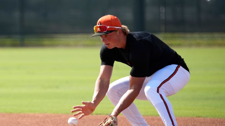 Orioles infielder Jackson Holliday scoops up a ground ball during drills on Tuesday. The Baltimore Orioles held their first full-squad workout of the 2025 spring training season on Tuesday, Feb. 18th in Sarasota, Florida.