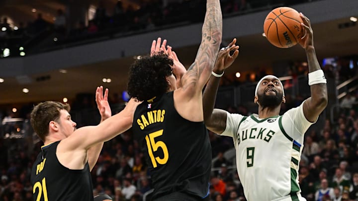 Feb 10, 2025; Milwaukee, Wisconsin, USA;  Milwaukee Bucks forward Bobby Portis (9) takes a shot against Golden State Warriors forward Gui Santos (15) and forward Quinten Post (21) in the third quarterat Fiserv Forum. Mandatory Credit: Benny Sieu-Imagn Images
