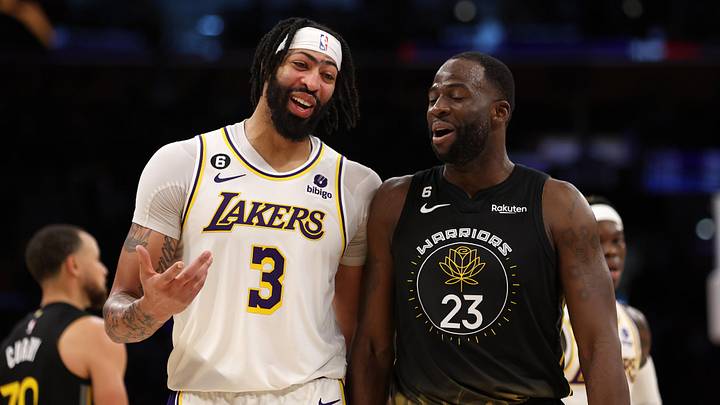 Mar 5, 2023; Los Angeles, California, USA;  Los Angeles Lakers forward Anthony Davis (3) and Golden State Warriors forward Draymond Green (23) talk during the fourth quarter at Crypto.com Arena. Mandatory Credit: Kiyoshi Mio-Imagn Images
