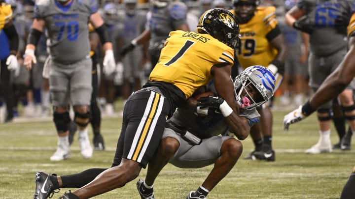 Missouri Tigers defensive back Jaylon Carlies (1) tackles Memphis Tigers wide receiver Demeer Blankumsee (0) Missouri Tigers defensive back Jaylon Carlies (1) tackles Memphis Tigers wide receiver Demeer Blankumsee (0)