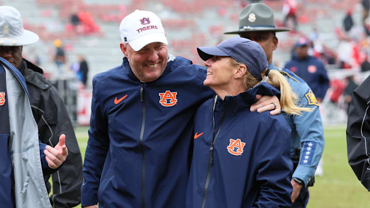 Oct 25, 2025; Fayetteville, Arkansas, USA; Auburn Tigers head coach Hugh Freeze and his wife Jill Freeze celebrate after the game against the Arkansas Razorbacks at Donald W. Reynolds Razorback Stadium. Auburn won 33-24. Mandatory Credit: Nelson Chenault-Imagn Images Oct 25, 2025; Fayetteville, Arkansas, USA; Auburn Tigers head coach Hugh Freeze and his wife Jill Freeze celebrate after the game against the Arkansas Razorbacks at Donald W. Reynolds Razorback Stadium. Auburn won 33-24. Mandatory Credit: Nelson Chenault-Imagn Images