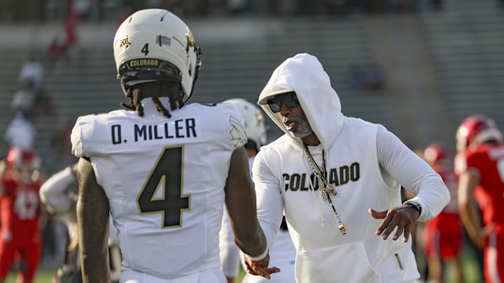 Sep 12, 2025; Houston, Texas, USA; Colorado Buffaloes head coach Deion Sanders shakes hands with wide receiver Omarion Miller (4) before the game against the Houston Cougars at TDECU Stadium. Mandatory Credit: Troy Taormina-Imagn Images Sep 12, 2025; Houston, Texas, USA; Colorado Buffaloes head coach Deion Sanders shakes hands with wide receiver Omarion Miller (4) before the game against the Houston Cougars at TDECU Stadium. Mandatory Credit: Troy Taormina-Imagn Images