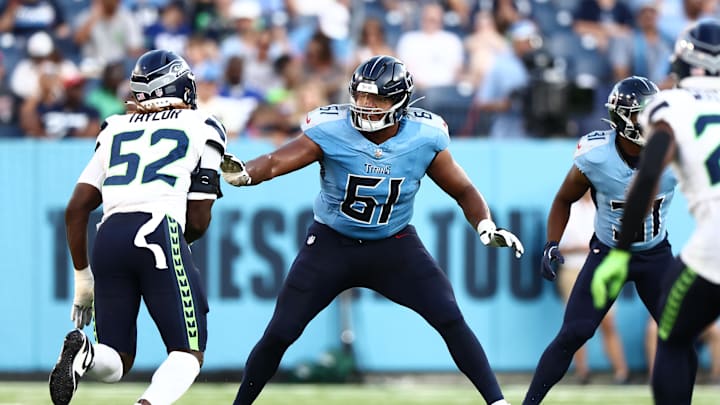 Aug 17, 2024; Nashville, Tennessee, USA; Tennessee Titans offensive tackle John Ojukwu (61) blocks Seattle Seahawks linebacker Darrell Taylor (52) in the second quarter at Nissan Stadium. Mandatory Credit: Casey Gower-Imagn Images