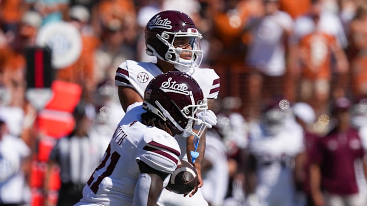 Mississippi State Bulldogs running back Davon Booth (21) takes a handoff from quarterback Michael Van Buren Jr. (0) in the first half against the Texas Longhorns at Darrell K Royal-Texas Memorial Stadium.