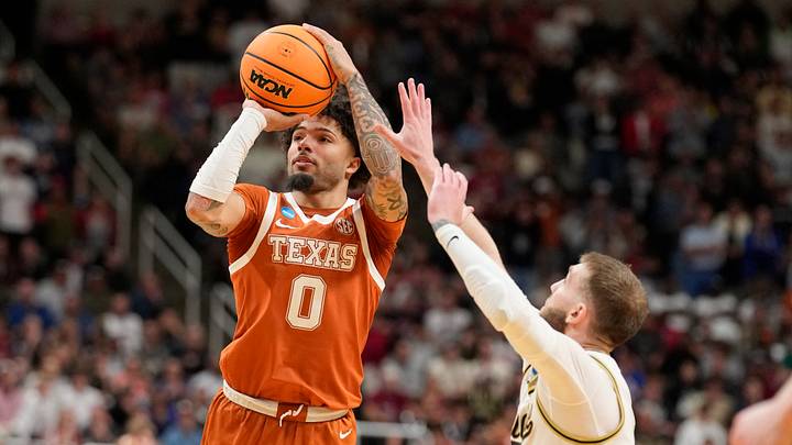 Mar 26, 2026; San Jose, CA, USA; Texas Longhorns guard Jordan Pope (0) shoots past Purdue Boilermakers guard Braden Smith (3) in the second half during a Sweet Sixteen game of the West Regional of the men's 2026 NCAA Tournament at SAP Center. Mandatory Credit: Kyle Terada-Imagn Images