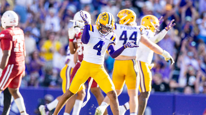 Nov 15, 2025; Baton Rouge, Louisiana, USA;  LSU Tigers cornerback Mansoor Delane (4) reacts to a stop on fourth down against the Arkansas Razorbacks during the second half at Tiger Stadium. Mandatory Credit: Stephen Lew-Imagn Images