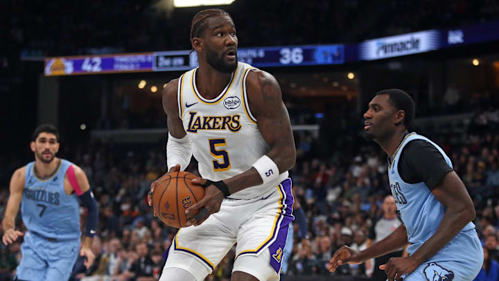 Oct 31, 2025; Memphis, Tennessee, USA; Los Angeles Lakers center Deandre Ayton (5) spins to the basket as Memphis Grizzlies forward Vince Williams Jr. (5) defends during the second quarter at FedExForum. Mandatory Credit: Petre Thomas-Imagn Images