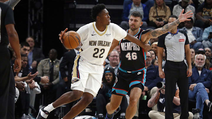 Oct 22, 2025; Memphis, Tennessee, USA; New Orleans Pelicans center Derik Queen (22) dribbles as Memphis Grizzlies John Konchar (46) defends during the second quarter at FedExForum. Mandatory Credit: Petre Thomas-Imagn Images Oct 22, 2025; Memphis, Tennessee, USA; New Orleans Pelicans center Derik Queen (22) dribbles as Memphis Grizzlies John Konchar (46) defends during the second quarter at FedExForum. Mandatory Credit: Petre Thomas-Imagn Images