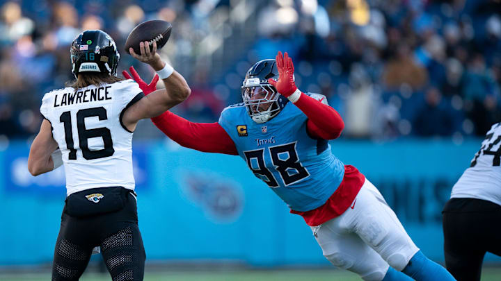 Tennessee defensive tackle Jeffery Simmons (98) hits the chest of Jacksonville quarterback Trevor Lawrence (16) to alter his third-down throw during their game at Nissan Stadium Sunday, Nov. 30, 2025. Jacksonville was forced to punt.