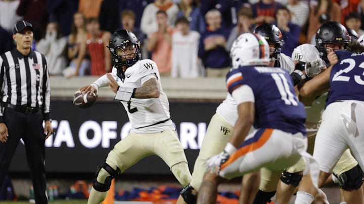 Nov 8, 2025; Charlottesville, Virginia, USA; Wake Forest Demon Deacons quarterback Robby Ashford (2) throws the ball against the Virginia Cavaliers during the first half at Scott Stadium. Mandatory Credit: Amber Searls-Imagn Images Nov 8, 2025; Charlottesville, Virginia, USA; Wake Forest Demon Deacons quarterback Robby Ashford (2) throws the ball against the Virginia Cavaliers during the first half at Scott Stadium. Mandatory Credit: Amber Searls-Imagn Images