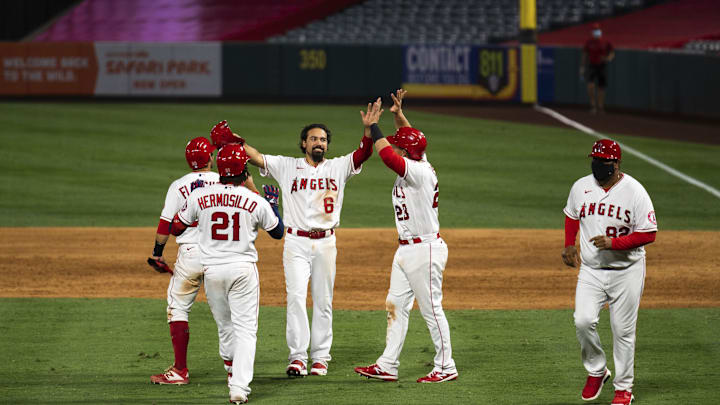 Aug 1, 2020; Anaheim, California, USA; Los Angeles Angels third baseman Anthony Rendon (6) is congratulated by third baseman Matt Thaiss (23) against the Houston Astros during the game at Angel Stadium. Mandatory Credit: Angels Baseball/Pool Photo via USA TODAY Network