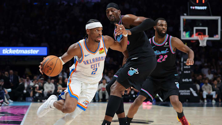 Jan 17, 2026; Miami, Florida, USA; Oklahoma City Thunder guard Shai Gilgeous-Alexander (2) drives to the basket against Miami Heat center Bam Adebayo (13) during the second quarter at Kaseya Center. Mandatory Credit: Sam Navarro-Imagn Images