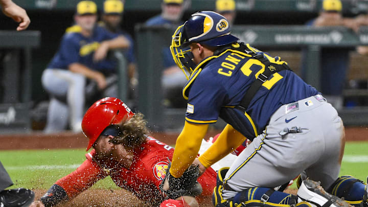Sep 19, 2025; St. Louis, Missouri, USA;  St. Louis Cardinals second baseman Brendan Donovan (33) is tagged out at home by Milwaukee Brewers catcher William Contreras (24) during the third inning at Busch Stadium. Mandatory Credit: Jeff Curry-Imagn Images
