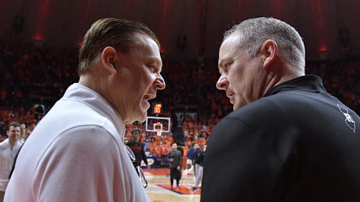 Jan 21, 2024; Champaign, Illinois, USA; Illinois Fighting Illini head coach Brad Underwood, left, and Rutgers Scarlet Knights head coach Steve Pikiell talk before a game at State Farm Center. Mandatory Credit: Ron Johnson-Imagn Images