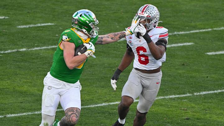 Jan 1, 2025; Pasadena, CA, USA; Oregon Ducks tight end Terrance Ferguson (3) stiff arms Ohio State Buckeyes safety Lathan Ransom (8) during a third quarter pass play at Rose Bowl Stadium. Mandatory Credit: Robert Hanashiro-Imagn Images