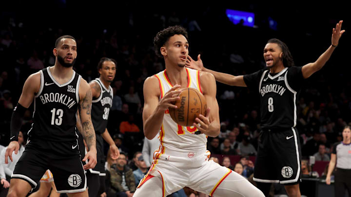 Apr 10, 2025; Brooklyn, New York, USA; Atlanta Hawks forward Zaccharie Risacher (10) controls the ball against Brooklyn Nets guard Tyrese Martin (13) and forward Ziaire Williams (8) during the third quarter at Barclays Center. Mandatory Credit: Brad Penner-Imagn Images Apr 10, 2025; Brooklyn, New York, USA; Atlanta Hawks forward Zaccharie Risacher (10) controls the ball against Brooklyn Nets guard Tyrese Martin (13) and forward Ziaire Williams (8) during the third quarter at Barclays Center. Mandatory Credit: Brad Penner-Imagn Images