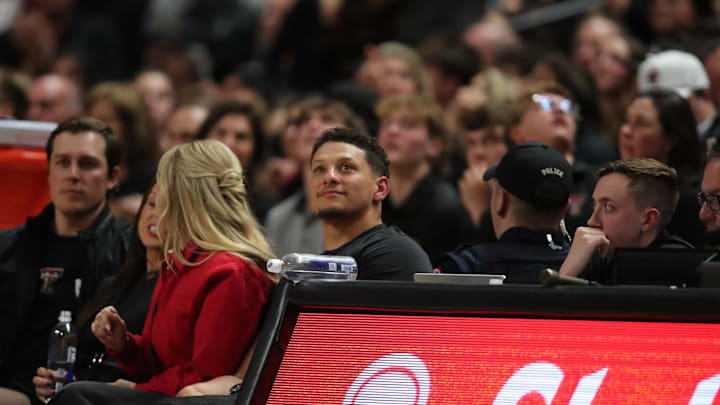 Feb 24, 2025; Lubbock, Texas, USA;  NFL Kansas City Chiefs player and Texas Tech Red Raiders alumni Patrick Mahomes II watches during the second half in the game against the Houston Cougars at United Supermarkets Arena. Mandatory Credit: Michael C. Johnson-Imagn Images