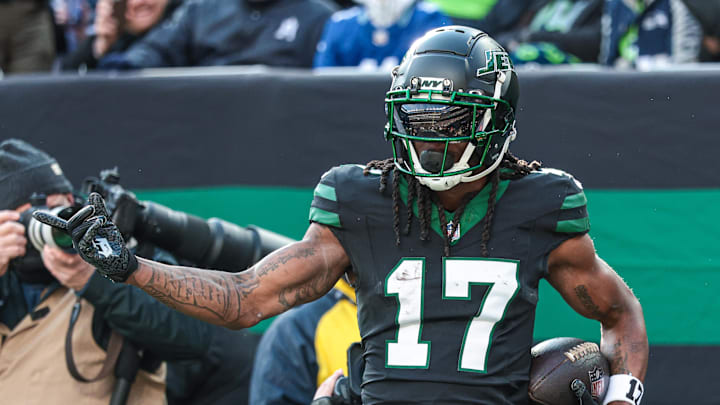 New York Jets wide receiver Davante Adams celebrates a touchdown catch.