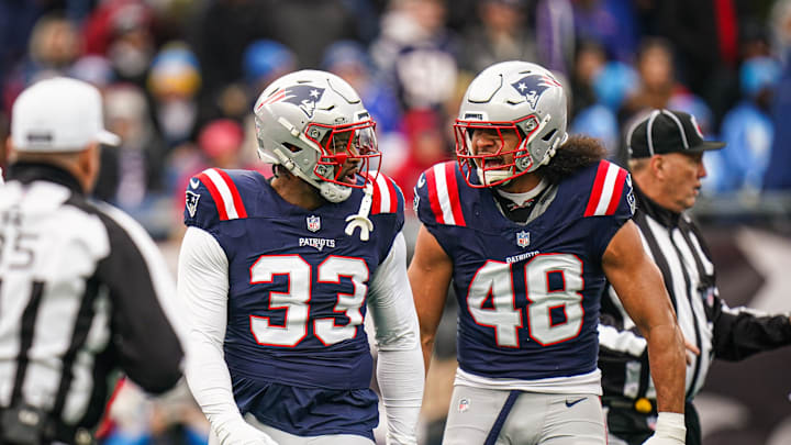 Dec 28, 2024; Foxborough, Massachusetts, USA; New England Patriots linebacker Anfernee Jennings (33) and linebacker Jahlani Tavai (48) react after a play against the Los Angeles Chargers in the first quarter at Gillette Stadium. Mandatory Credit: David Butler II-Imagn Images