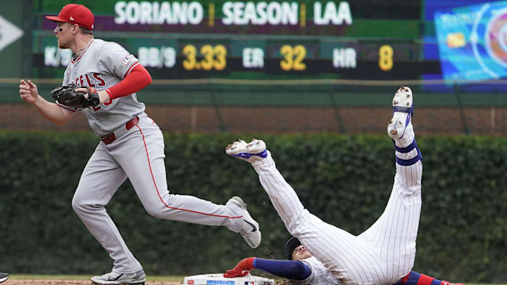 Jul 7, 2024; Chicago, Illinois, USA; Los Angeles Angels second base Brandon Drury (23) tags out Chicago Cubs catcher Miguel Amaya (9) out at second baseman during the third inning at Wrigley Field. Mandatory Credit: David Banks-USA TODAY Sports