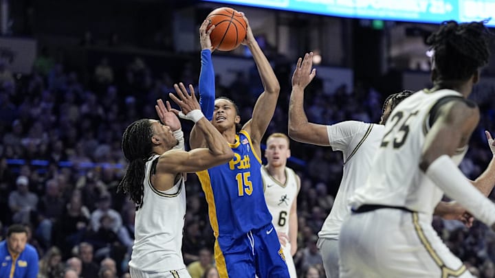 Feb 1, 2025; Winston-Salem, North Carolina, USA; Pittsburgh Panthers guard Jaland Lowe (15) shoots under pressure from Wake Forest Demon Deacons guard Hunter Sallis (23) during the second half at Lawrence Joel Veterans Memorial Coliseum. Mandatory Credit: Jim Dedmon-Imagn Images