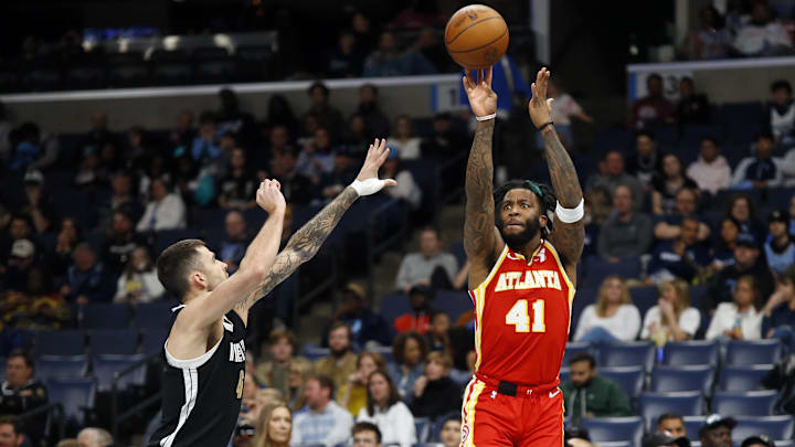 Mar 8, 2024; Memphis, Tennessee, USA; Atlanta Hawks forward Saddiq Bey (41) shoots for three as Memphis Grizzlies guard John Konchar (46) defends during the first half at FedExForum. Mandatory Credit: Petre Thomas-Imagn Images