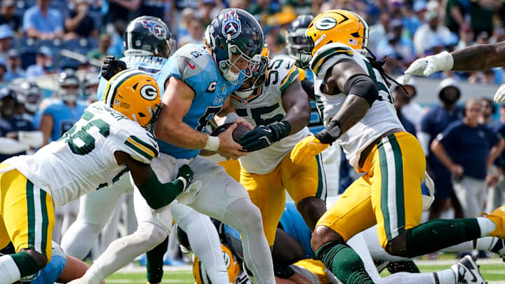 Tennessee Titans quarterback Will Levis (8) is sacked by Green Bay Packers linebacker Edgerrin Cooper (56) as defensive ends Kingsley Enagbare (55) and Rashan Gary (52) arrive on the scene.