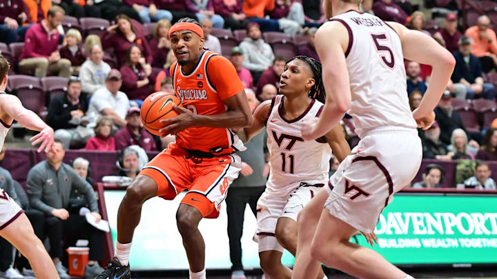 Mar 1, 2025; Blacksburg, Virginia, USA;  Syracuse Orange guard J.J. Starling (2) moves toward the basket as Virginia Tech Hokies guard Ben Hammond (11) defends during the first half at Cassell Coliseum. Mandatory Credit: Brian Bishop-Imagn Images