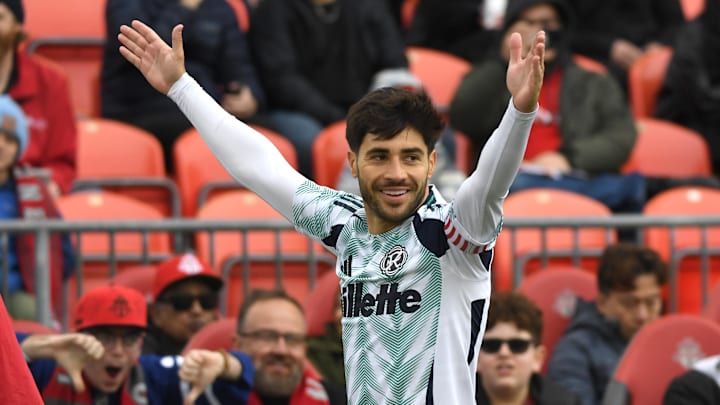 May 3, 2025; Toronto, Ontario, CAN;   New England Revolution midfielder Carles Gil (10) celebrates after scoring a goal against Toronto FC in the first half at BMO Field. Mandatory Credit: Dan Hamilton-Imagn Images