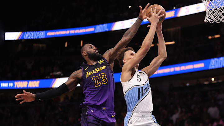 Dec 6, 2024; Atlanta, Georgia, USA; Los Angeles Lakers forward LeBron James (23) blocks the shot of Atlanta Hawks guard Dyson Daniels (5) in overtime at State Farm Arena. Mandatory Credit: Brett Davis-Imagn Images Dec 6, 2024; Atlanta, Georgia, USA; Los Angeles Lakers forward LeBron James (23) blocks the shot of Atlanta Hawks guard Dyson Daniels (5) in overtime at State Farm Arena. Mandatory Credit: Brett Davis-Imagn Images