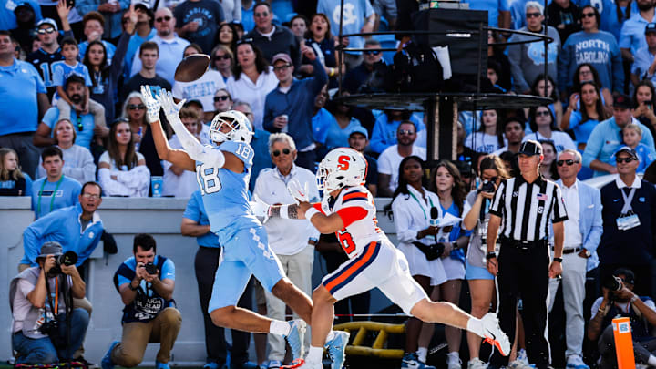 Oct 7, 2023; Chapel Hill, North Carolina, USA; North Carolina Tar Heels tight end Bryson Nesbit (18) reaches up for a touchdown catch during the first half of the game against the Syracuse Orange at Kenan Memorial Stadium. Mandatory Credit: Jaylynn Nash-Imagn Images