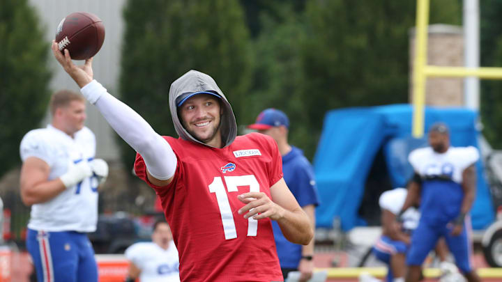 Bills quarterback Josh Allen warms up on the sidelines during the Buffalo Bills training camp at St. John Fisher University. Bills quarterback Josh Allen warms up on the sidelines during the Buffalo Bills training camp at St. John Fisher University.
