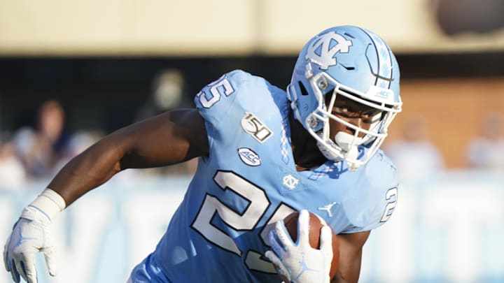 Sep 21, 2019; Chapel Hill, NC, USA;  North Carolina Tar Heels running back Javonte Williams (25) runs with the ball during the second half against the Appalachian State Mountaineers at Kenan Memorial Stadium. The Appalachian State Mountaineers defeats the North Carolina Tar Heels 34-31. Mandatory Credit: James Guillory-Imagn Images