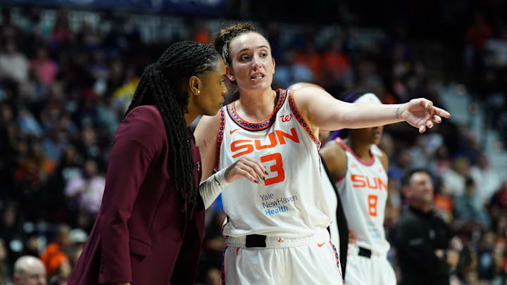 Sep 6, 2025; Uncasville, Connecticut, USA; Connecticut Sun associate head coach Roneeka Hodges talks with guard Marina Mabrey (3) during a break against the Phoenix Mercury in the second half at Mohegan Sun Arena. 