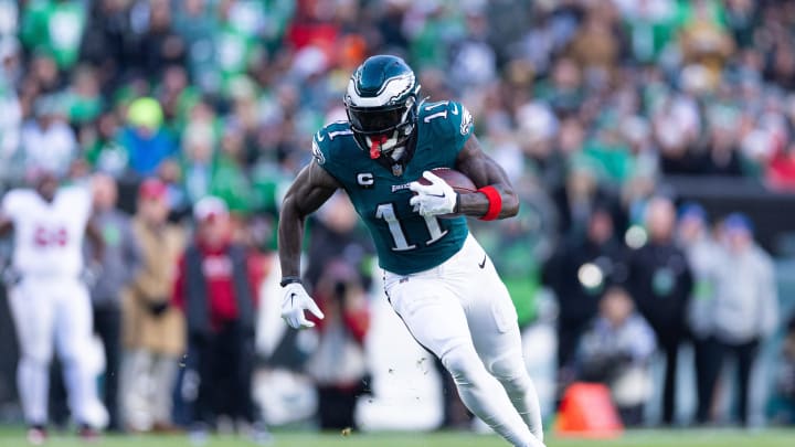 Dec 31, 2023; Philadelphia, Pennsylvania, USA; Philadelphia Eagles wide receiver A.J. Brown (11) runs with the ball during the fourth quarter against the Arizona Cardinals at Lincoln Financial Field. Bill Streicher-USA TODAY Sports