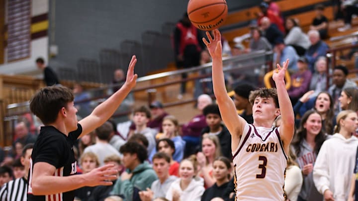 Bloomington North’s Caleb Fishel (3) makes a 3-pointer over Edgewood’s Reece Roberts during the boys’ basketball game at Bloomington North on Thursday, Feb. 6, 2025.