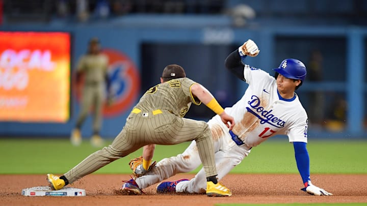Aug 15, 2025; Los Angeles, California, USA; Los Angeles Dodgers designated hitter Shohei Ohtani (17) is caught stealing by San Diego Padres second base Jake Cronenworth (9) during the third inning at Dodger Stadium. Mandatory Credit: Gary A. Vasquez-Imagn Images Aug 15, 2025; Los Angeles, California, USA; Los Angeles Dodgers designated hitter Shohei Ohtani (17) is caught stealing by San Diego Padres second base Jake Cronenworth (9) during the third inning at Dodger Stadium. Mandatory Credit: Gary A. Vasquez-Imagn Images