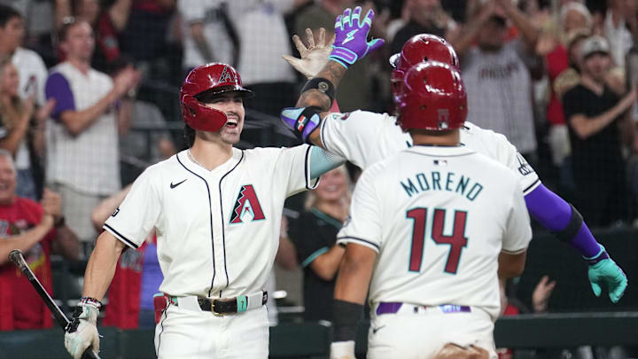 Arizona Diamondbacks Corbin Carroll (7) celebrates a 2-run home run by teammate Ketel Marte (4) against the San Diego Padres at Chase Field in Phoenix on Sept. 29, 2024.