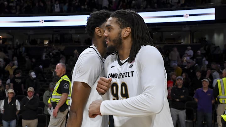 Jan 10, 2026; Nashville, Tennessee, USA; Vanderbilt Commodores forward Devin McGlockton (99) and forward Jalen Washington (13) celebrates the win against the Louisiana State Tigers during the second half at Memorial Gymnasium. Mandatory Credit: Steve Roberts-Imagn Images