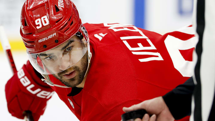 Jan 14, 2025; Detroit, Michigan, USA;  Detroit Red Wings center Joe Veleno (90) gets set to face off in the second period against the San Jose Sharks at Little Caesars Arena. Mandatory Credit: Rick Osentoski-Imagn Images