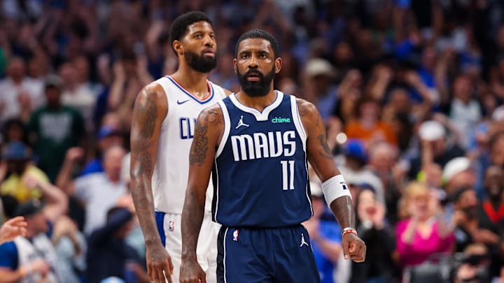 Dallas Mavericks guard Kyrie Irving (11) reacts in front of LA Clippers forward Paul George (13) after scoring during the second half during game four of the first round for the 2024 NBA playoffs at American Airlines Center. Mandatory Credit: Kevin Jairaj-Imagn Images