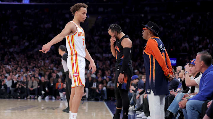 Apr 20, 2026; New York, New York, USA; Atlanta Hawks guard Dyson Daniels (5) talks to Knicks fan Spike Lee after fouling New York Knicks guard Jalen Brunson (11) during the first quarter of game two of the first round of the 2026 NBA Playoffs at Madison Square Garden. Mandatory Credit: Brad Penner-Imagn Images