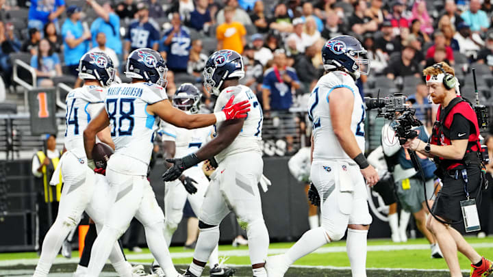 Oct 12, 2025; Paradise, Nevada, USA; Tennessee Titans tight end David Martin-Robinson (88) scores a touchdown during the second half against Las Vegas Raiders at Allegiant Stadium. Mandatory Credit: Stephen R. Sylvanie-Imagn Images
