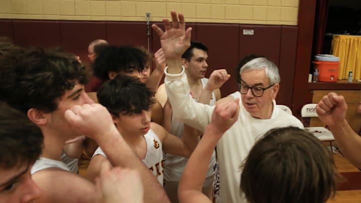Junction City boys basketball coach Craig Rothenberger (middle with glasses) was one of Oregon's all-time winningest coaches, before passing recently at the age of 78.