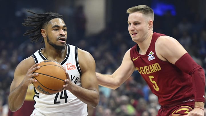 Mar 11, 2025; Cleveland, Ohio, USA; Brooklyn Nets guard Cam Thomas (24) dribbles beside Cleveland Cavaliers guard Sam Merrill (5) in the first quarter at Rocket Arena. Mandatory Credit: David Richard-Imagn Images Mar 11, 2025; Cleveland, Ohio, USA; Brooklyn Nets guard Cam Thomas (24) dribbles beside Cleveland Cavaliers guard Sam Merrill (5) in the first quarter at Rocket Arena. Mandatory Credit: David Richard-Imagn Images