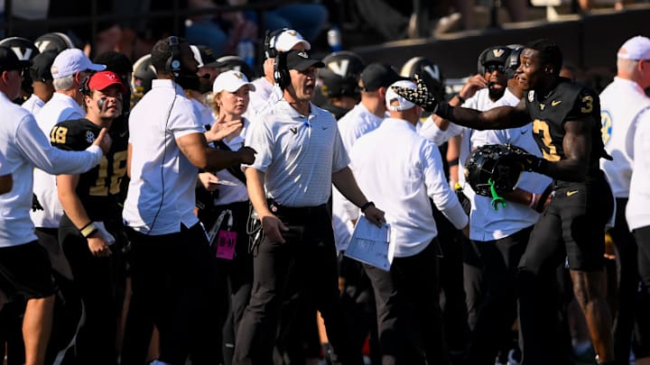 Oct 5, 2024; Nashville, Tennessee, USA;  Vanderbilt Commodores head coach Clark Lea screams at wide receiver Quincy Skinner Jr. (3) against the Alabama Crimson Tide during the first half at FirstBank Stadium. 