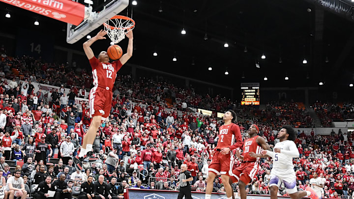 Mar 7, 2024; Pullman, Washington, USA; Washington State Cougars guard Isaiah Watts (12) dunks the ball against the Washington Huskies in the first half at Friel Court at Beasley Coliseum. Mandatory Credit: James Snook-Imagn Images