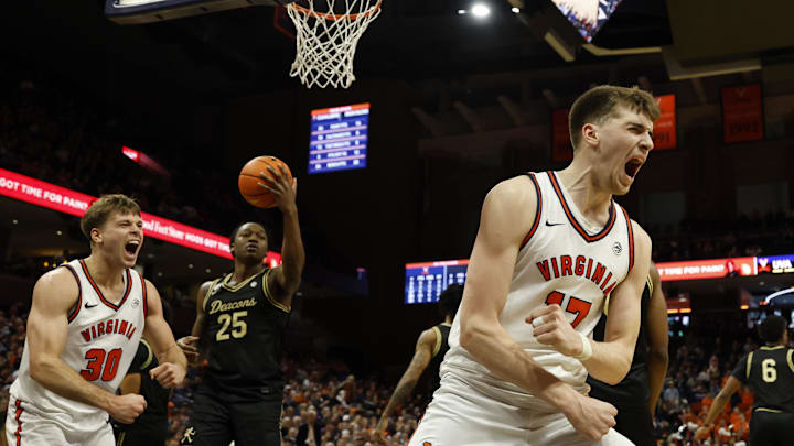 Mar 3, 2026; Charlottesville, Virginia, USA; Virginia Cavaliers center Johann Grünloh (17) reacts after scoring while being fouled by Wake Forest Demon Deacons forward Tre'von Spillers (25) in the second half at John Paul Jones Arena. Mandatory Credit: Geoff Burke-Imagn Images
