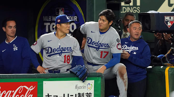 Mar 18, 2025; Bunkyo, Tokyo, JPN; Los Angeles Dodgers starting pitcher Yoshinobu Yamamoto (18) and designated hitter Shohei Ohtani (17) stand in the dugout during the fifth inning against the Chicago Cubs during the Tokyo Series at Tokyo Dome. Mar 18, 2025; Bunkyo, Tokyo, JPN; Los Angeles Dodgers starting pitcher Yoshinobu Yamamoto (18) and designated hitter Shohei Ohtani (17) stand in the dugout during the fifth inning against the Chicago Cubs during the Tokyo Series at Tokyo Dome.