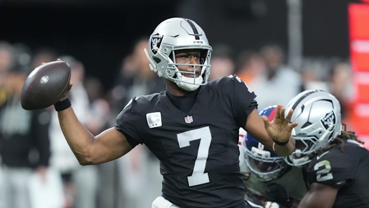 Dec 28, 2025; Paradise, Nevada, USA; Las Vegas Raiders quarterback Geno Smith (7) throws in the third quarter against the New York Giants at Allegiant Stadium. Mandatory Credit: Kirby Lee-Imagn Images